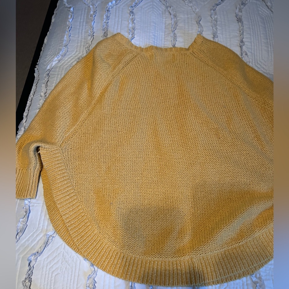 Awesome gold poncho sweater from Anthropologie